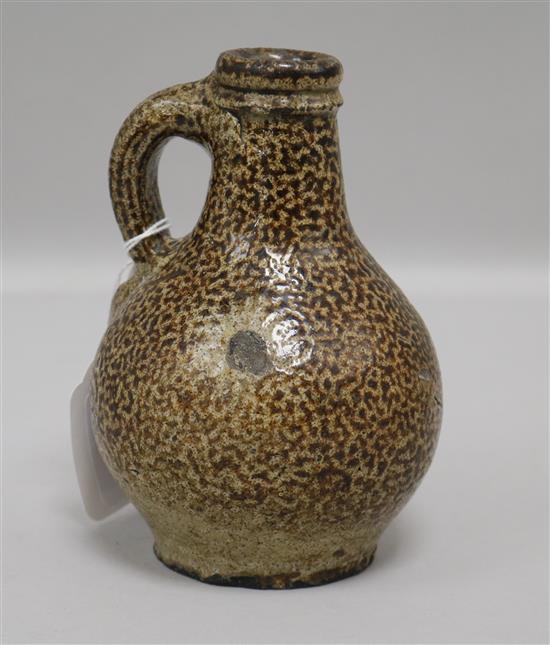 A small tiger ware jug, probably 17th century, H 14cm approx